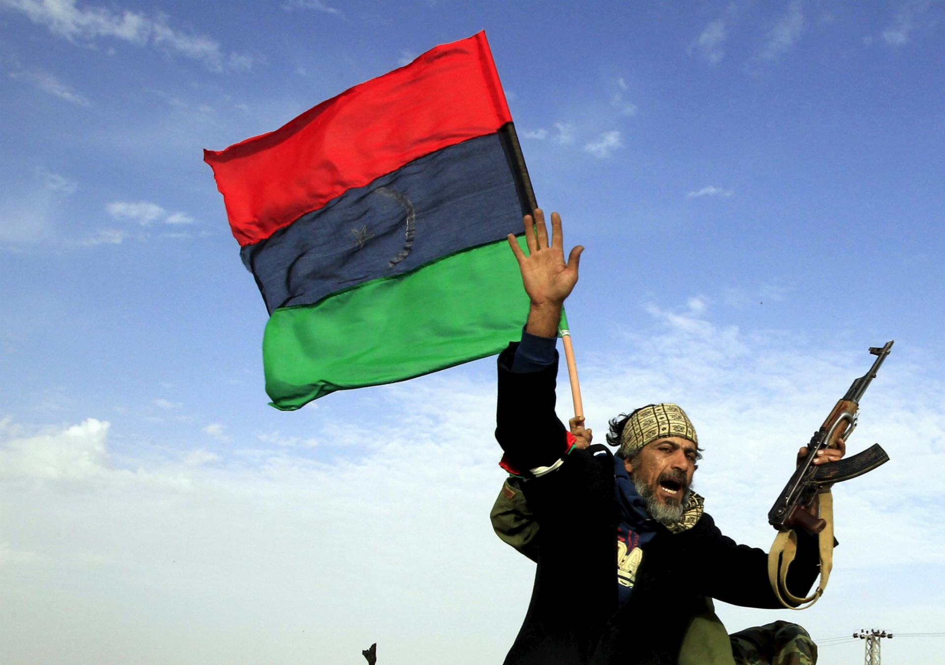 Povstalec bojujúci proti Kaddáfiho režimu. Snímka: Reuters