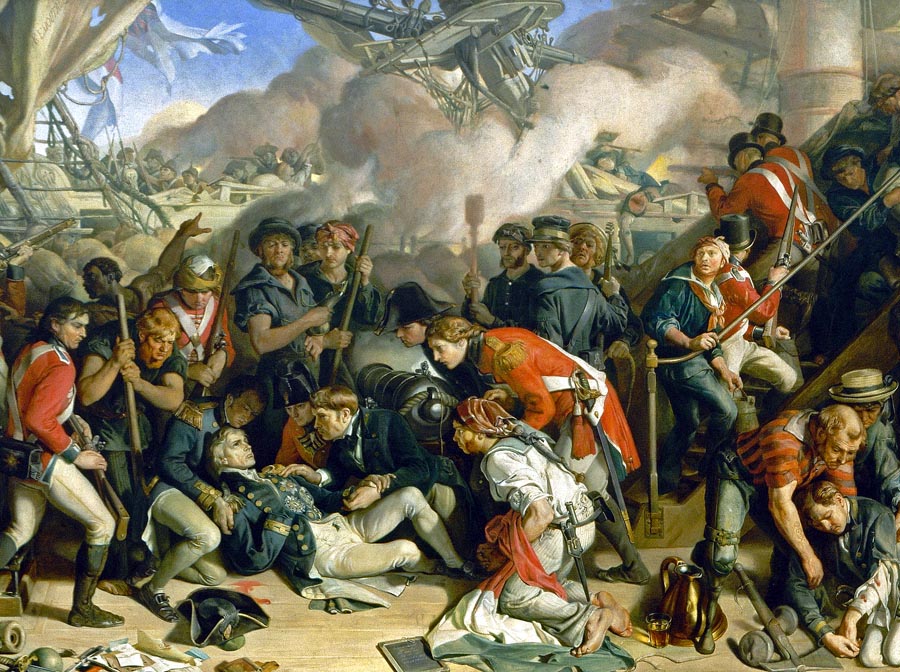 Smrteľne zranený admirál Nelson na palube HMS Victory, obklopený členmi posádky. Výjav je fragmentom z veľkoplošnej nástennej maľby, ktorú v roku 1864 vytvoril Daniel Maclise a zdobí Kráľovskú galériu vo Westminsterskom paláci v Londýne.