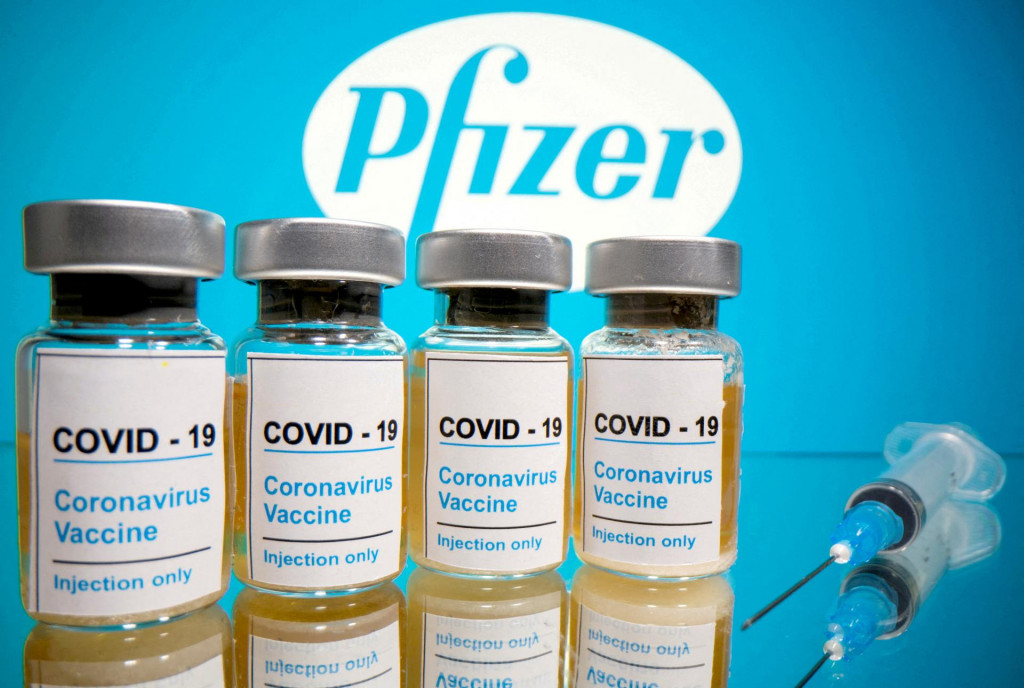 &lt;p&gt;FILE PHOTO: Vials with a sticker reading, ”COVID-19/Coronavirus vaccine/Injection only” and a medical syringe are seen in front of a displayed Pfizer logo in this illustration taken October 31, 2020. REUTERS/Dado Ruvic/File Photo&lt;/p&gt;