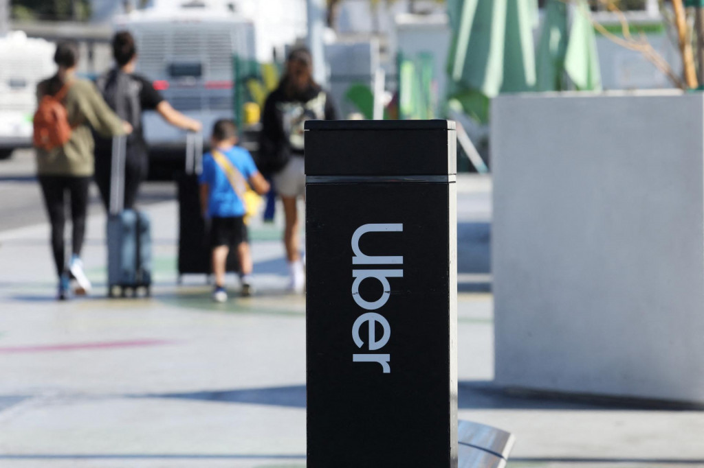 Uber signage is posted at Los Angeles International Airport (LAX) in Los Angeles, California, U.S. July 10, 2022. REUTERS/David Swanson