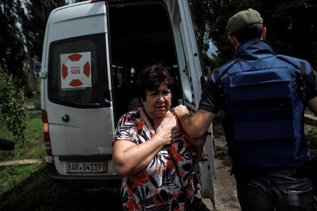 Mimovl&aacute;dna organiz&aacute;cia &bdquo;Vostok SOS&ldquo; evakuuje civilistov počas vojny na Ukrajine, august 2022. FOTO: REUTERS