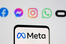 FILE PHOTO: The Meta logo is seen on smartphone in front of displayed logo of Facebook, Messenger, Instagram, WhatsApp, Oculus in this illustration picture taken October 28, 2021. REUTERS/Dado Ruvic/Illustration/File Photo