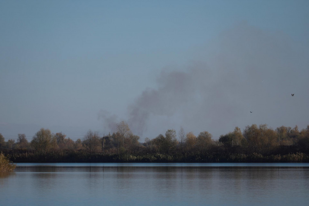 Smoke rises after shelling at an opposite side of the Dnipro river as Russia&lsquo;s retreat from Kherson, in Kherson, Ukraine November 14, 2022. REUTERS
