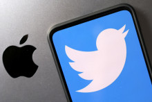 Smartphone with displayed Twitter logo is seen placed on Apple logo in this illustration taken, November 29, 2022. REUTERS/Dado Ruvic/Illustration