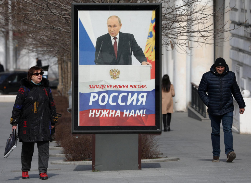 Bilboard s Vladimirom Putinom na Kryme. FOTO: REUTERS