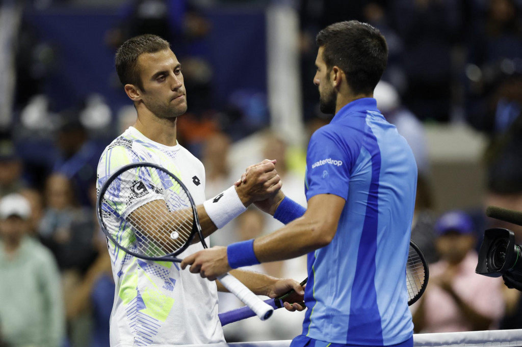 Novak Djokovič a Laslo Djere. FOTO: Geoff Burke/USA TODAY Sports