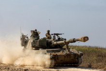 Izraelské sily pri hranici Pásma Gazy. FOTO: Reuters
