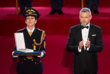 Na snímke prezident Peter Pellegrini tlieska na slávnostnej ceremónii udeľovania štátnych vyznamenaní v priestoroch Slovenskej filharmónie v Bratislave. FOTO: TASR/Jaroslav Novák