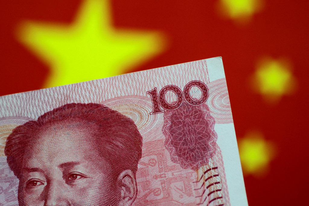 FILE PHOTO: FILE PHOTO: A China yuan note is seen in this illustration photo May 31, 2017. REUTERS/Thomas White/Illustration/File Photo/File Photo FOTO: Thomas White