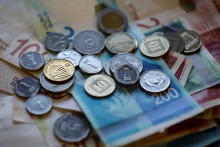 Izraelské šekely. FOTO: Reuters