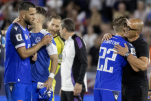Rradosť slovenských futbalistov po víťazstve 2:0 nad Nemeckom, sprava tréner Slovenska Francesco Calzona, hráči Stanislav Lobotka, Peter Pekarík a Dávid Hancko. FOTO: TASR/Martin Baumann